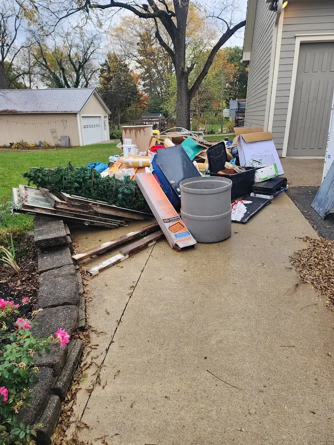 Dumpster being loaded with debris for 3 Yard Dumpster Rental in Leesville